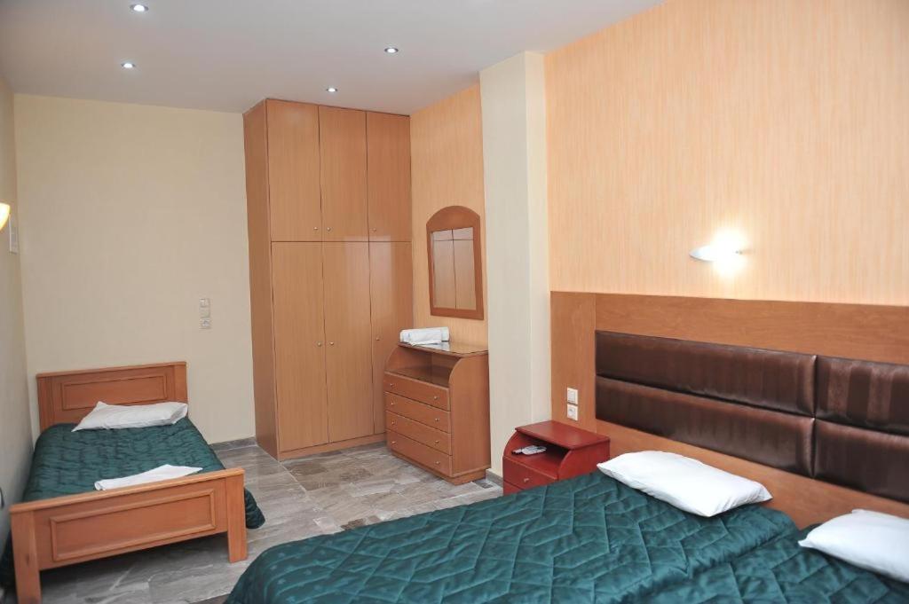 Postel nebo postele na pokoji v ubytování Kerkyra Beach Hotel & Apartments