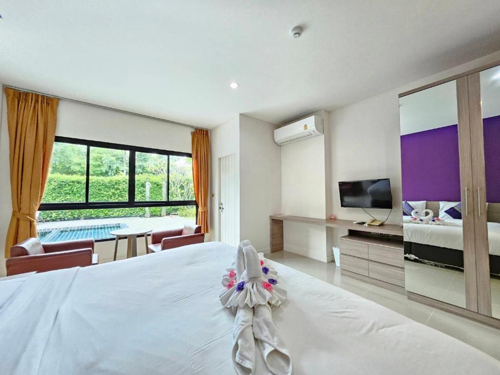 Postel nebo postele na pokoji v ubytování S4 Nai Yang Beach - Near Phuket Airport