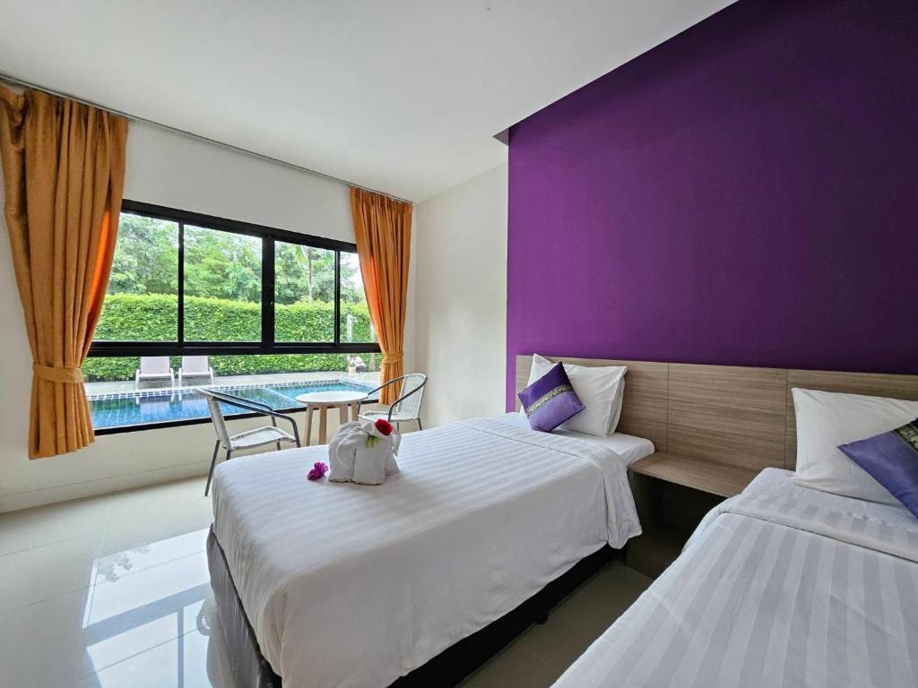 Postel nebo postele na pokoji v ubytování S4 Nai Yang Beach - Near Phuket Airport