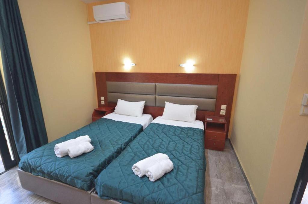 Postel nebo postele na pokoji v ubytování Kerkyra Beach Hotel & Apartments