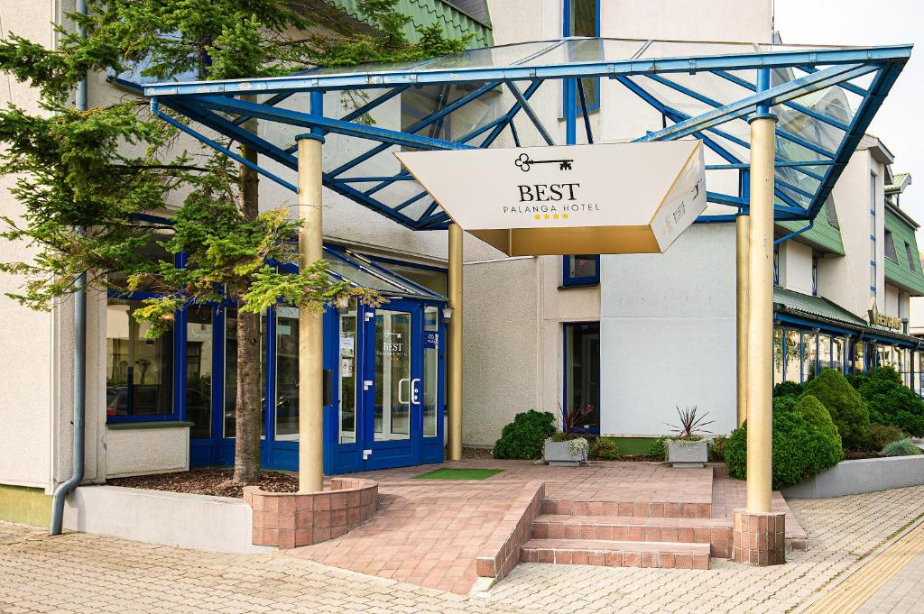 a building with a sign that says best in front of it at Best Palanga Hotel in Palanga