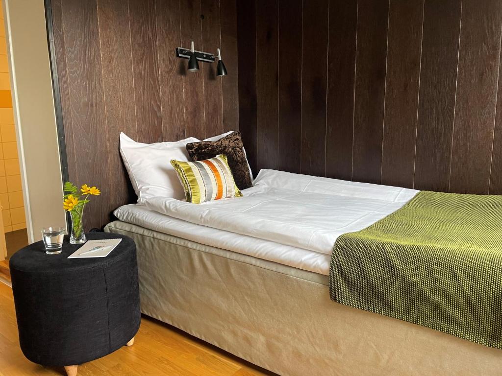 Postel nebo postele na pokoji v ubytování Sigtunahöjden Hotell & Konferens