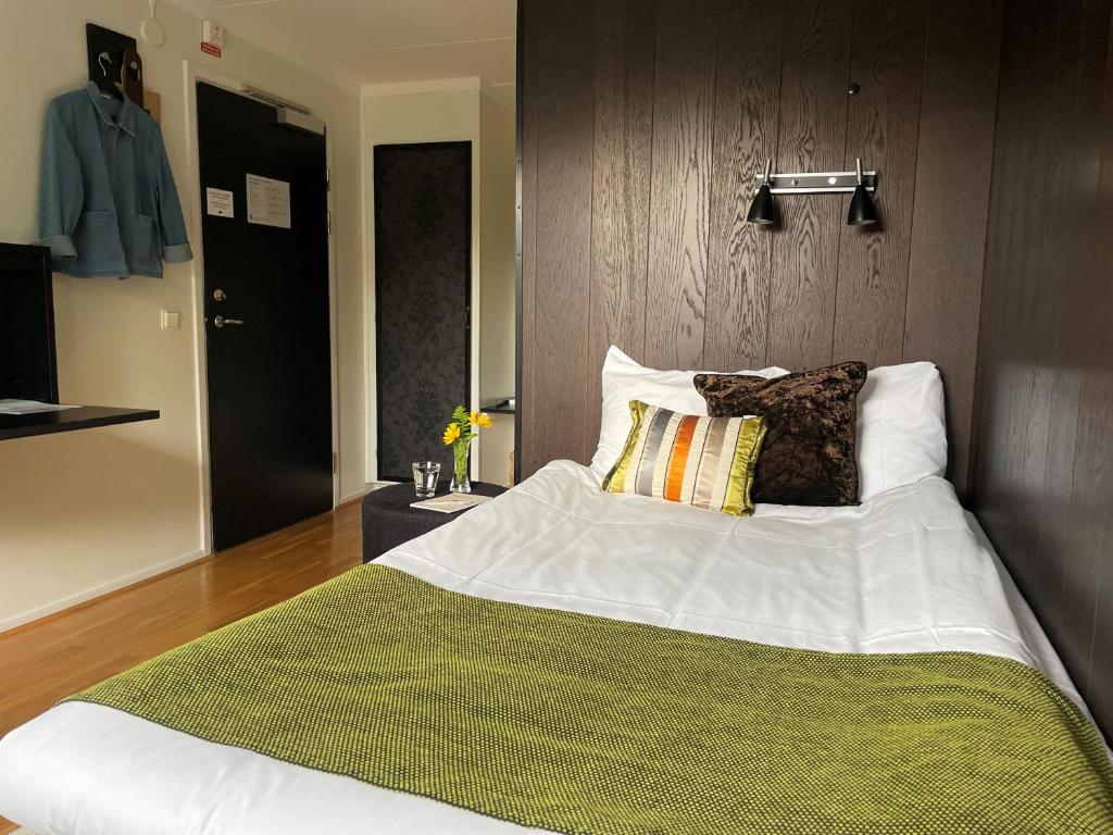 Postel nebo postele na pokoji v ubytování Sigtunahöjden Hotell & Konferens