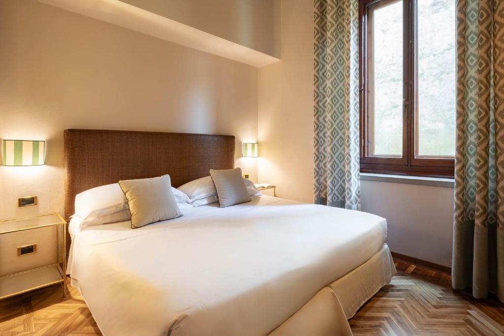Postel nebo postele na pokoji v ubytování Guest House Morandi