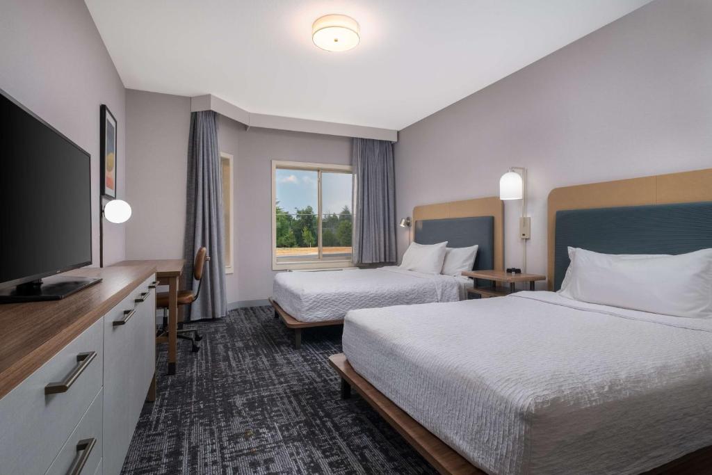 Postel nebo postele na pokoji v ubytování Homewood Suites Medford