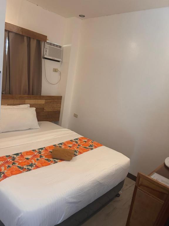 Voodi või voodid majutusasutuse Puyo Suites Homestay toas