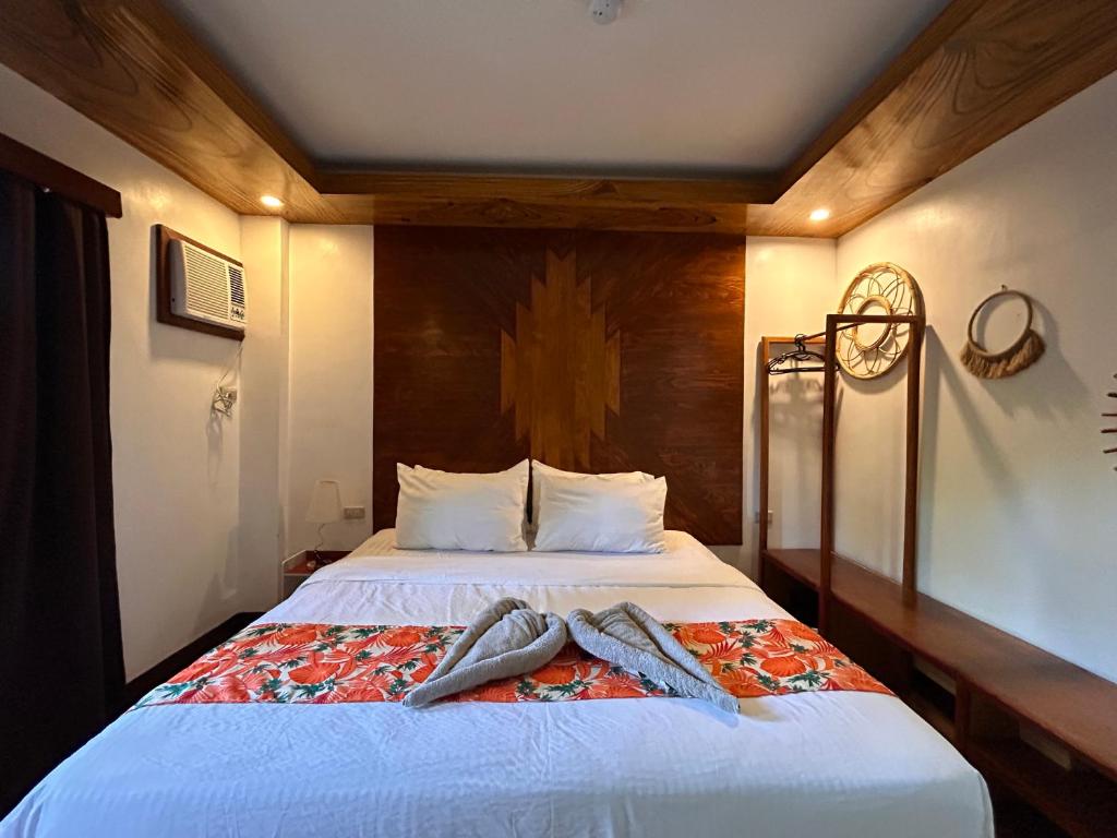 Voodi või voodid majutusasutuse Puyo Suites Homestay toas