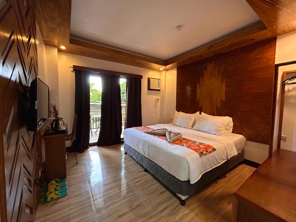 Voodi või voodid majutusasutuse Puyo Suites Homestay toas