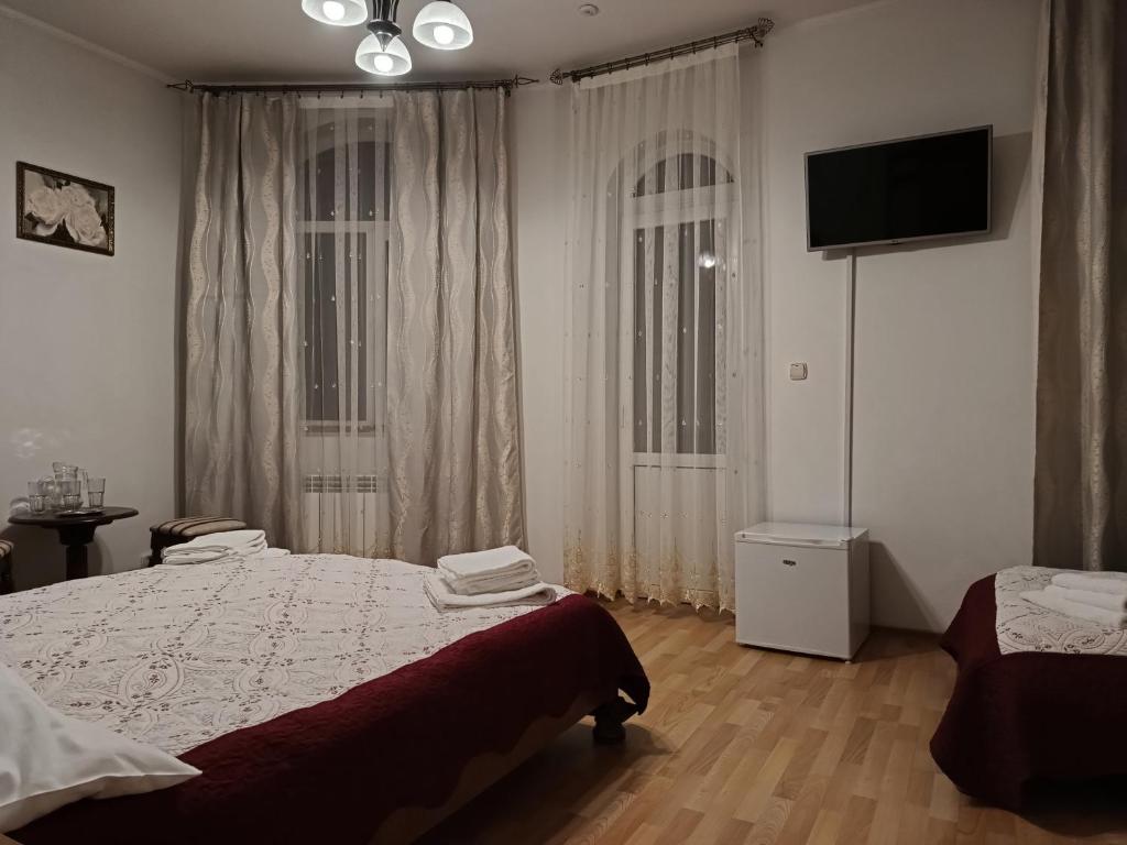 Postel nebo postele na pokoji v ubytování Вілла Токай