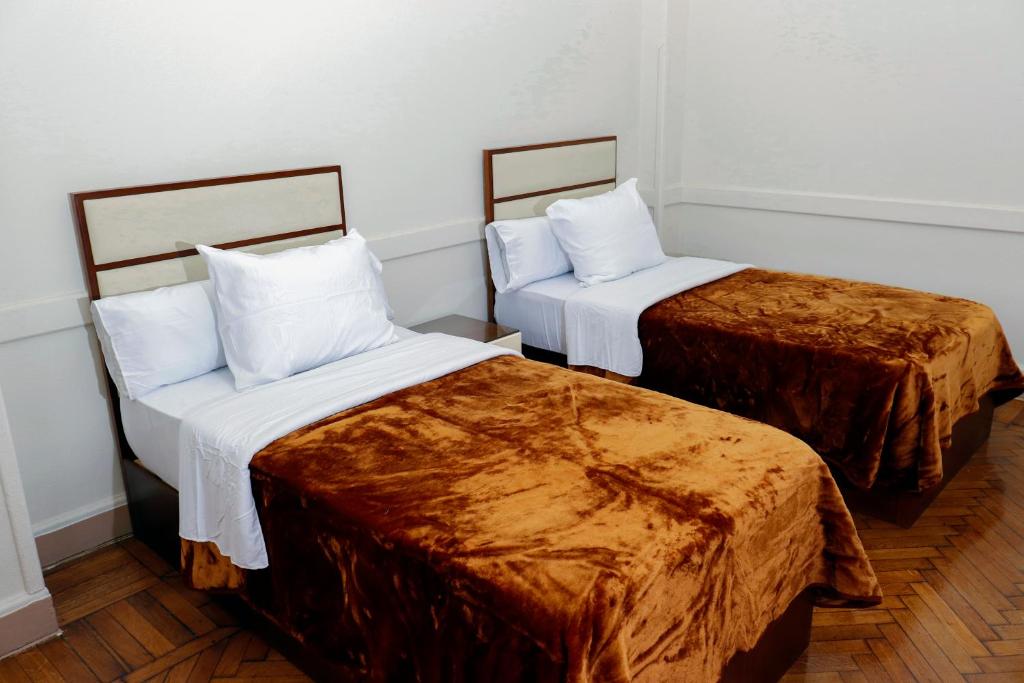 Postel nebo postele na pokoji v ubytování Ismailia House Inn