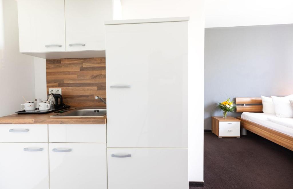Kuchyň nebo kuchyňský kout v ubytování Hotel Aviva