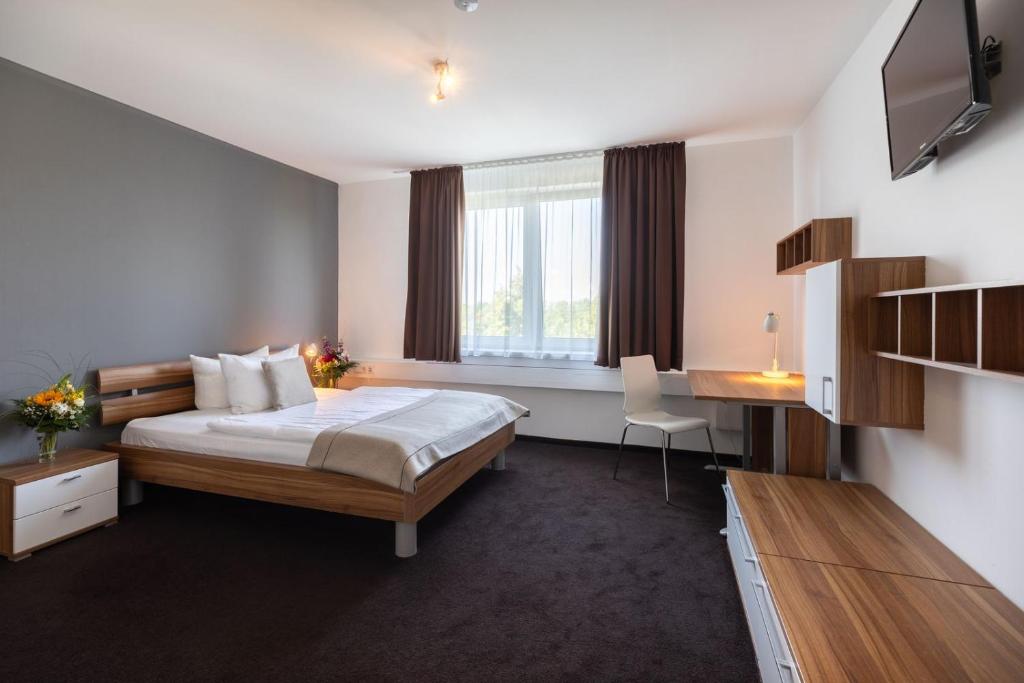 Postel nebo postele na pokoji v ubytování Hotel Aviva