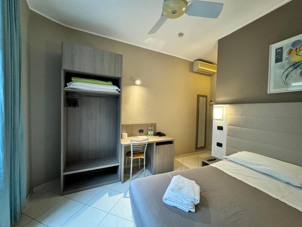 Postel nebo postele na pokoji v ubytování Hotel Parma