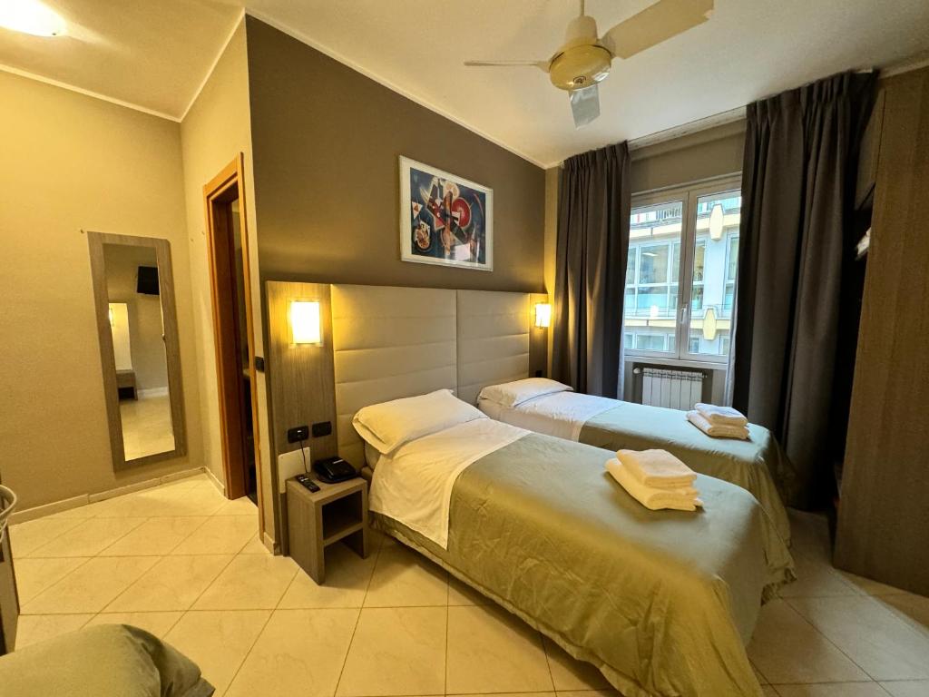 Postel nebo postele na pokoji v ubytování Hotel Parma