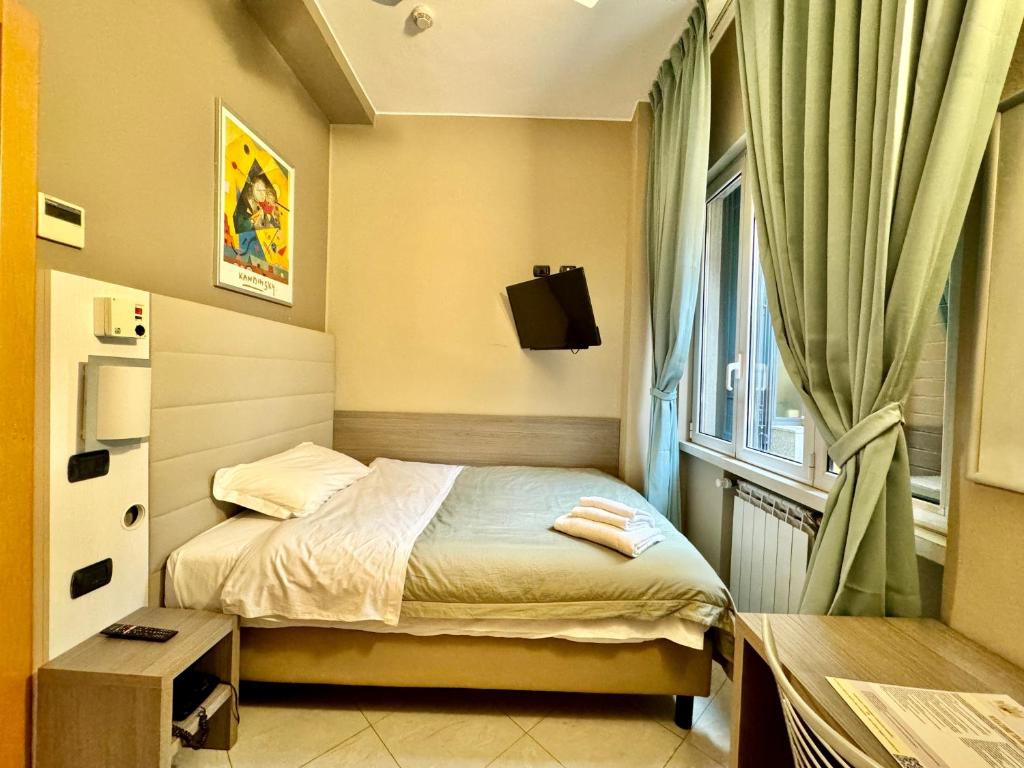 Postel nebo postele na pokoji v ubytování Hotel Parma