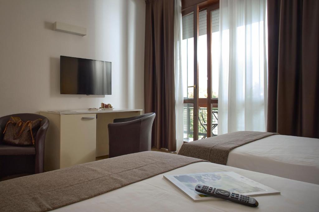 Postel nebo postele na pokoji v ubytování Hotel Eurorest