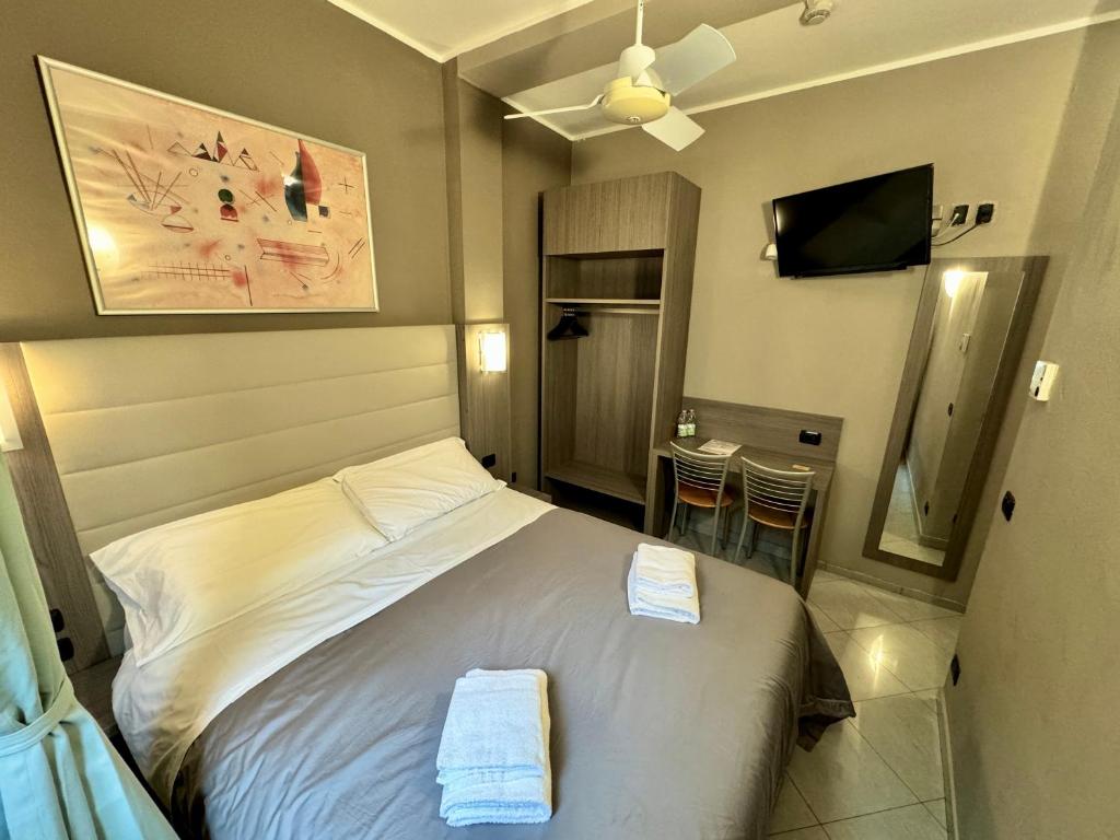 Postel nebo postele na pokoji v ubytování Hotel Parma