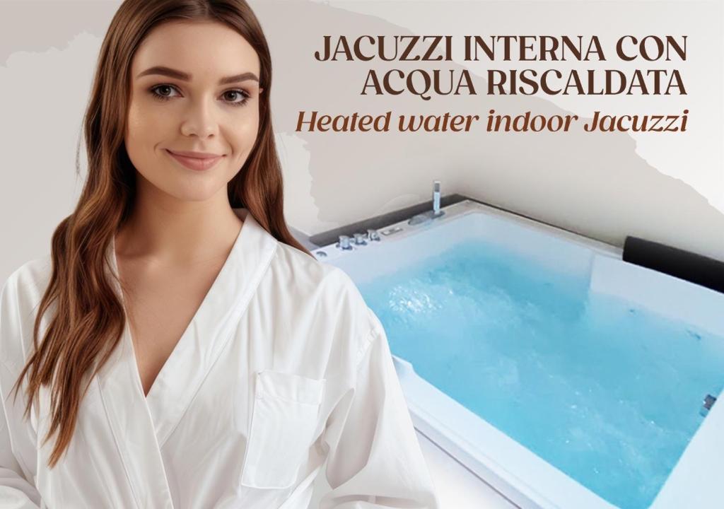 a woman in a laboratory with a tub of water at Casa Mediterranea Jacuzzi riscaldata con Caminetto in Specchiolla