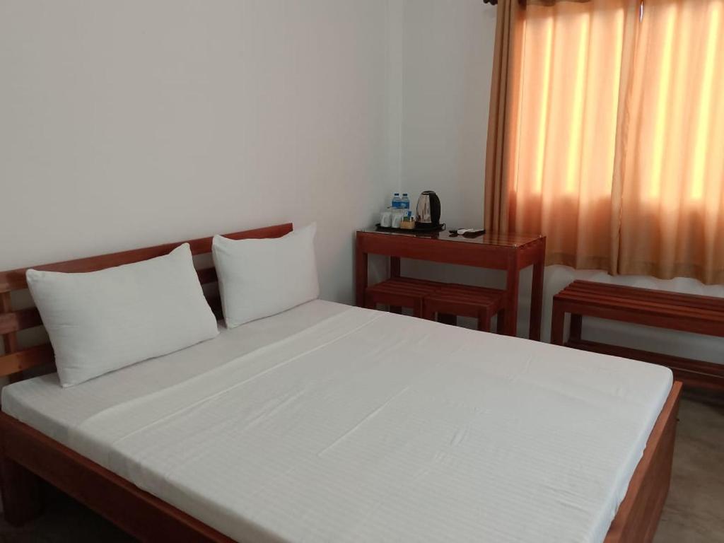 Postel nebo postele na pokoji v ubytování Seven Lotus Villa Kandy
