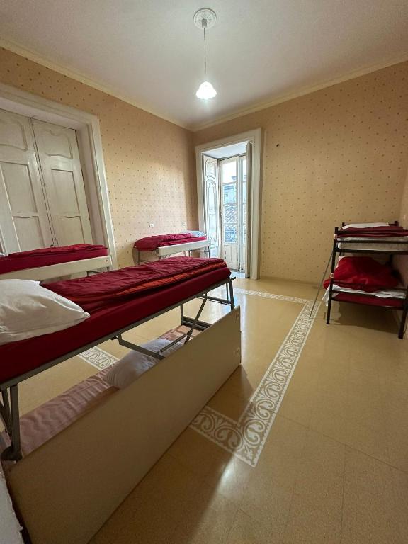 Postel nebo postele na pokoji v ubytování Salerno Experience Hostel
