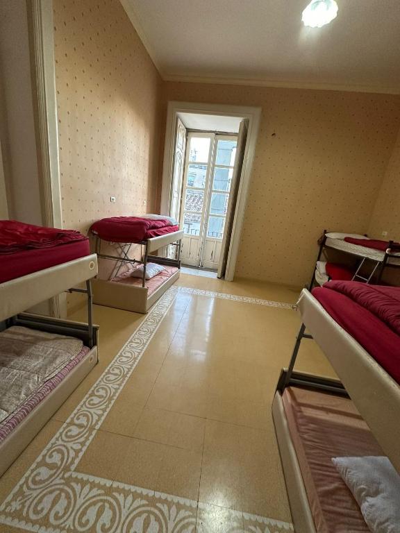 Postel nebo postele na pokoji v ubytování Salerno Experience Hostel