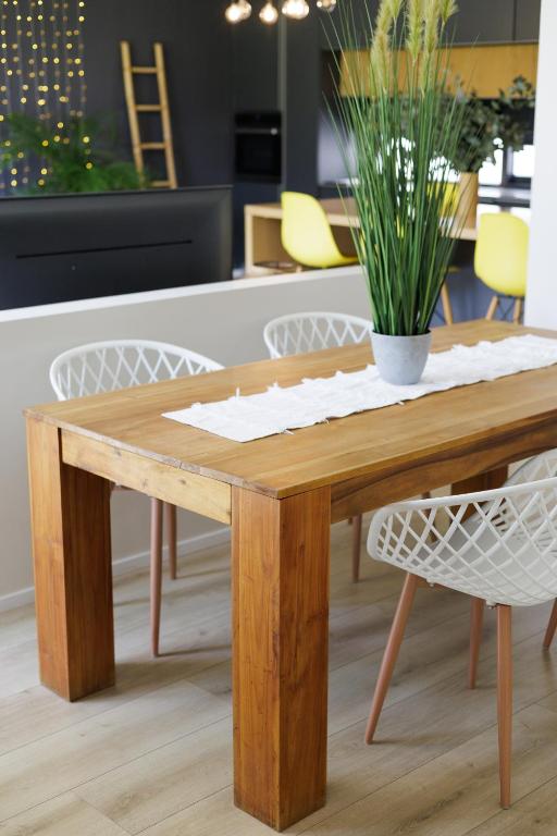 a wooden table with a potted plant on top at 4 Lulworth in Johannesburg