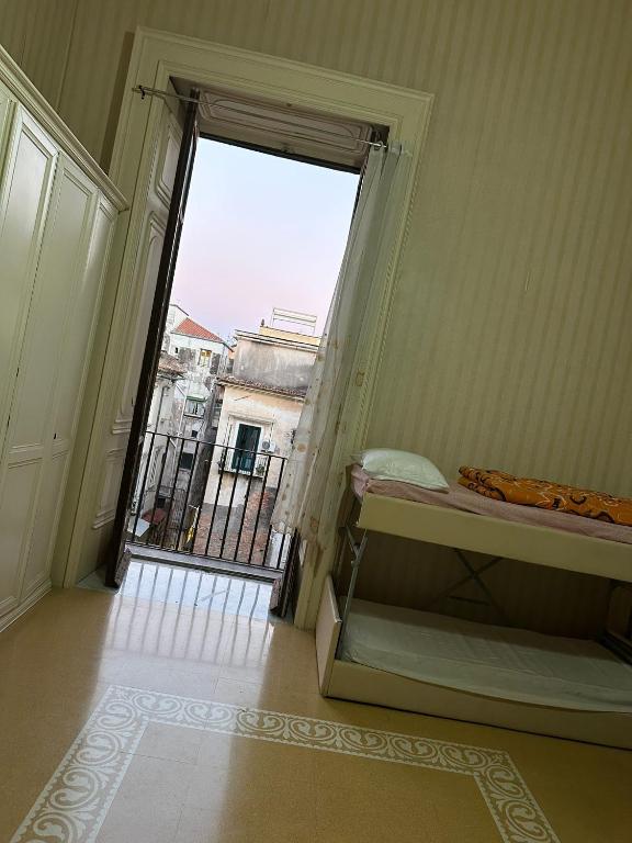Postel nebo postele na pokoji v ubytování Salerno Experience Hostel