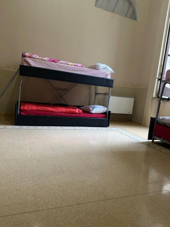 Postel nebo postele na pokoji v ubytování Salerno Experience Hostel