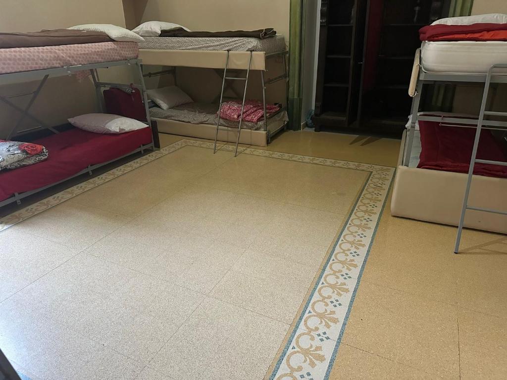 Postel nebo postele na pokoji v ubytování Salerno Experience Hostel