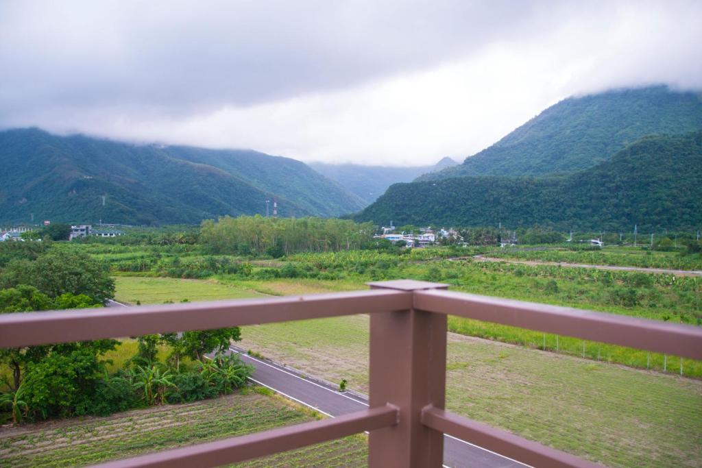 a view of a valley with a road and mountains at Hai Yue Wan Resort Club in Shunan