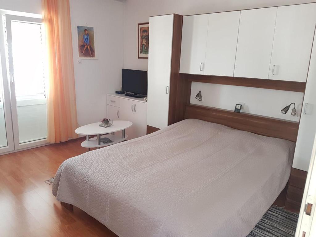 Posteľ alebo postele v izbe v ubytovaní Apartments Doris