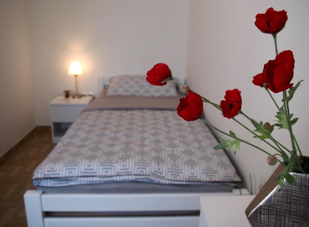 Posteľ alebo postele v izbe v ubytovaní Apartments Doris