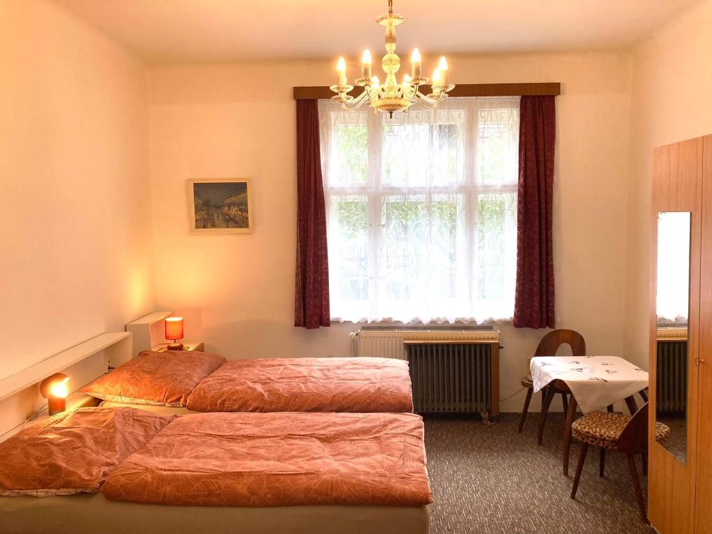 Postel nebo postele na pokoji v ubytování Soukromý pokoj v rodinném domě