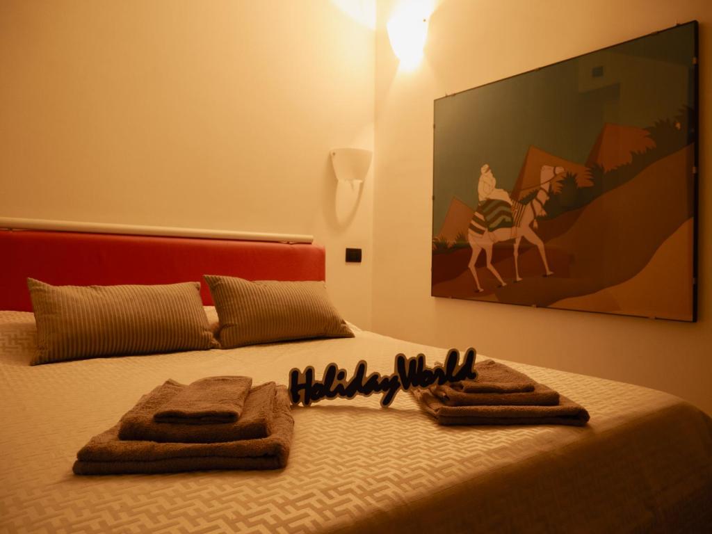 Postel nebo postele na pokoji v ubytování Dada House by Holiday World