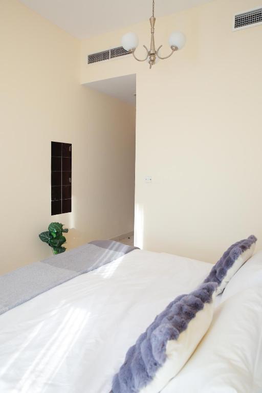 Postel nebo postele na pokoji v ubytování Agoo Homes