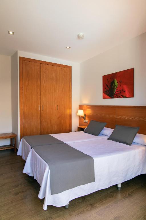 Posteľ alebo postele v izbe v ubytovaní Aparthotel Cal Marçal