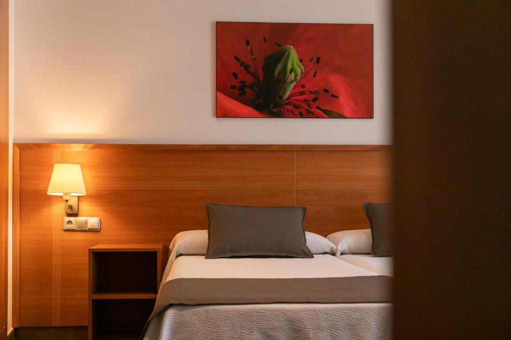 Posteľ alebo postele v izbe v ubytovaní Aparthotel Cal Marçal