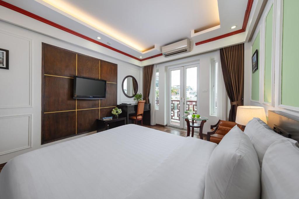 Postel nebo postele na pokoji v ubytování Viet Hotel & Travel