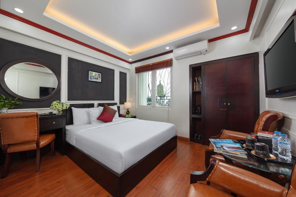 Postel nebo postele na pokoji v ubytování Viet Hotel & Travel