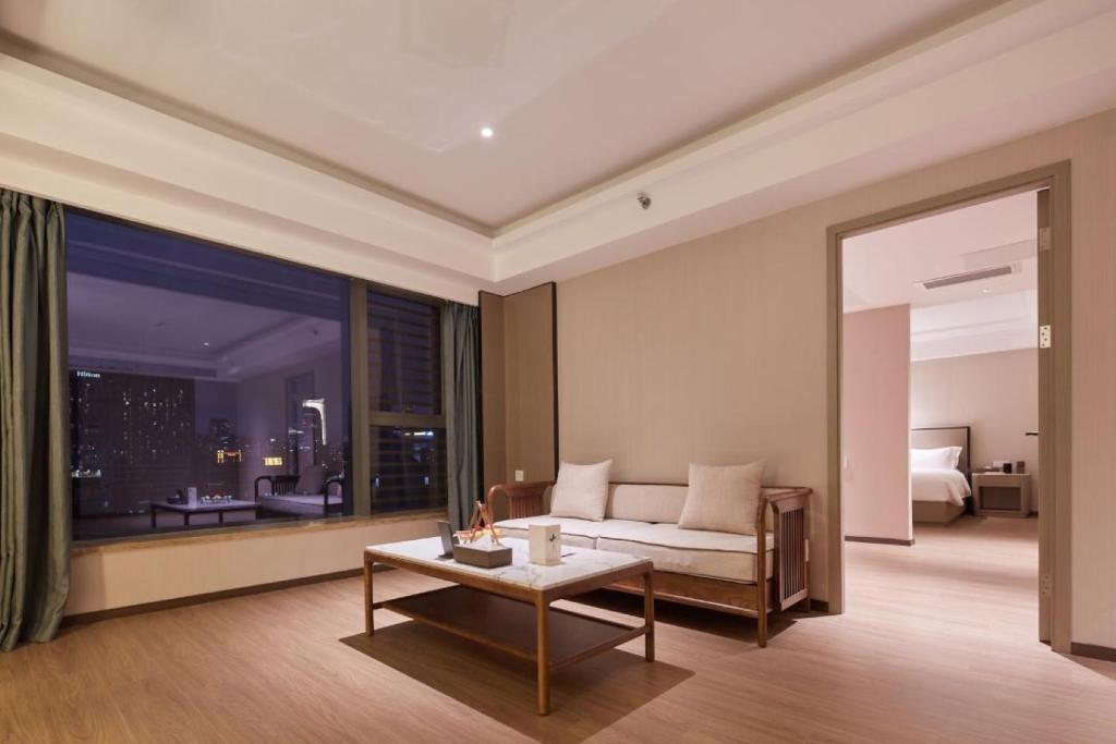 Posezení v ubytování Mehood Lestie International Hotel Linhexi Guangzhou East Railway Station Branch - Free Shuttle Bus to Canton Fair Complex During Canton Fair Period & Free afternoon tea & Free midnight snack & Free VPN Internet Access