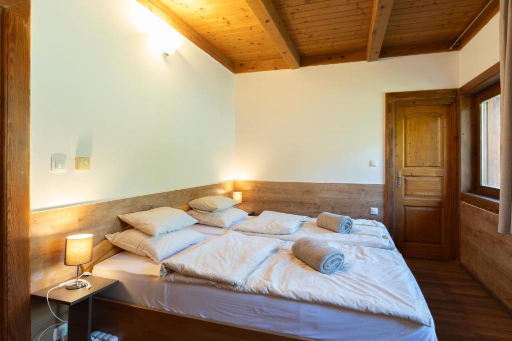 Postel nebo postele na pokoji v ubytování Grande Vendégház