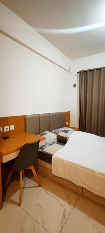 Postel nebo postele na pokoji v ubytování Skyhouse BSD 2 Bedroom & Studio Apartments - Perfect for ICE BSD Events