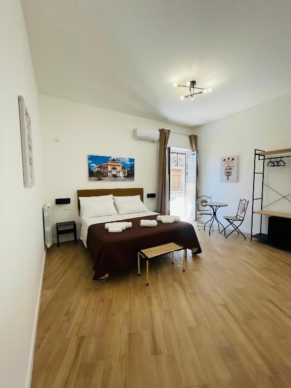 Postel nebo postele na pokoji v ubytování Bieddu Suites