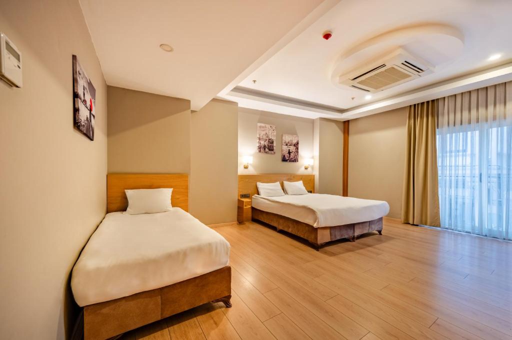 Postel nebo postele na pokoji v ubytování Beyoglu MLS Hotel