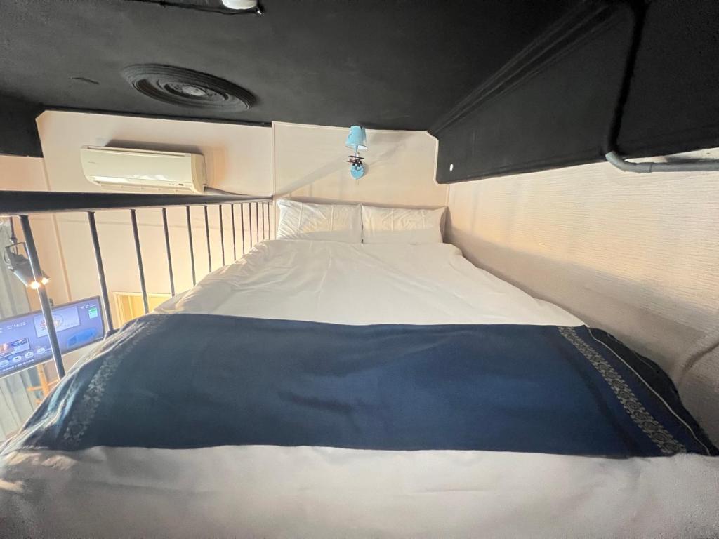 Postel nebo postele na pokoji v ubytování Mu-In Hotel
