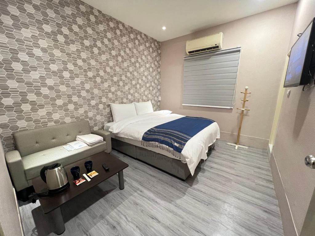 Postel nebo postele na pokoji v ubytování Mu-In Hotel