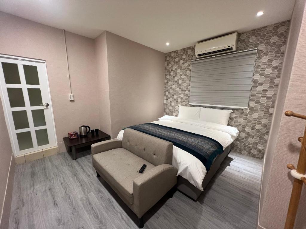 Postel nebo postele na pokoji v ubytování Mu-In Hotel