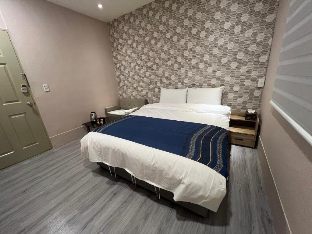 Postel nebo postele na pokoji v ubytování Mu-In Hotel
