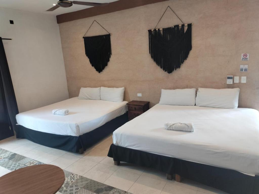 Postel nebo postele na pokoji v ubytování Hotel Casa Henequén