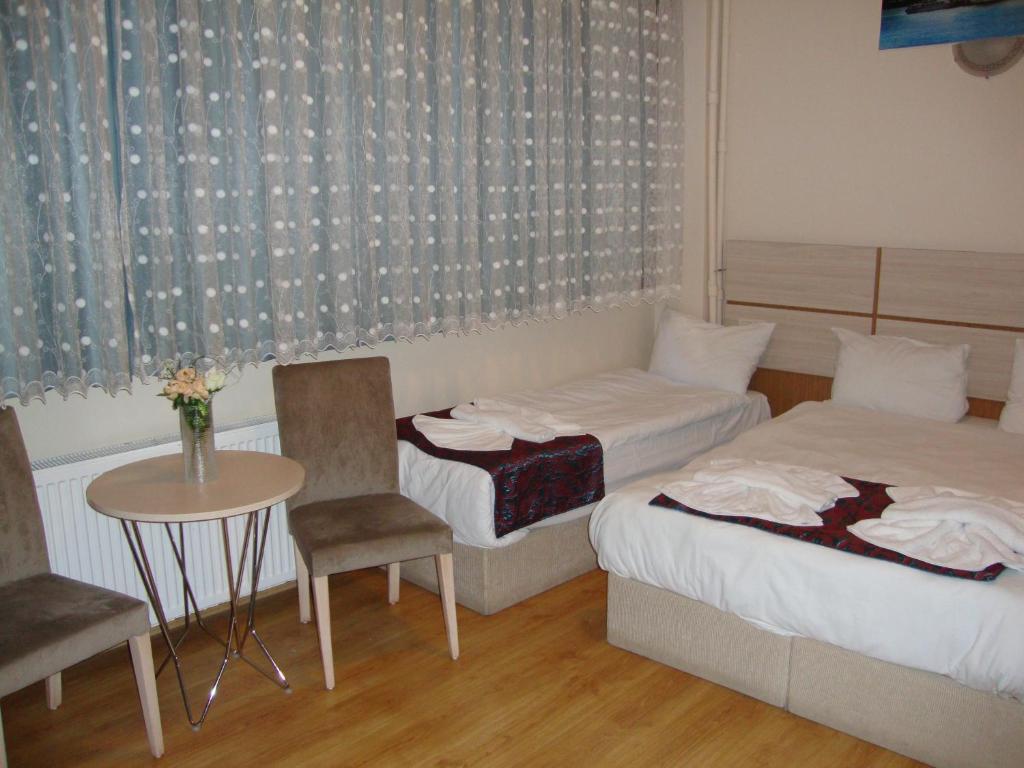Postel nebo postele na pokoji v ubytování Royal Suites Besiktas